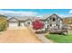 Charming home with a two-car garage, blossoming tree, and inviting deck at 3794 N State Highway 67, Sedalia, CO 80135