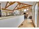 Spacious living room features a vaulted ceiling, wood beams, and a cozy fireplace at 3794 N State Highway 67, Sedalia, CO 80135
