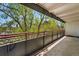 Spacious balcony offering views of lush greenery and urban surroundings at 1441 N Humboldt St # 204, Denver, CO 80218