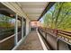 A serene balcony featuring sliding glass doors and red railings at 1441 N Humboldt St # 204, Denver, CO 80218