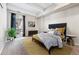Sunlit bedroom featuring a plush bed, decorative pillows, and modern accents at 1441 N Humboldt St # 204, Denver, CO 80218
