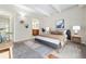Bright bedroom with neutral walls, patterned rug, and contemporary decor at 1441 N Humboldt St # 204, Denver, CO 80218