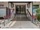 Building entrance with stairs leading to a glass door at 1441 N Humboldt St # 204, Denver, CO 80218