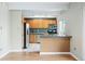 Functional kitchen with stainless steel appliances and a breakfast bar, perfect for casual dining and entertaining at 1441 N Humboldt St # 204, Denver, CO 80218