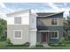 Striking two-story modern home with eye-catching split color scheme and low maintenance front yard at 1458 Coral Pl, Longmont, CO 80504