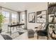 Modern home office featuring neutral walls, a sleek black desk, and contemporary decor at 3351 N Buchanan Way, Aurora, CO 80019