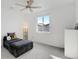 Minimalist bedroom with a plush lounge, natural light, and serene ambiance at 9667 Walden St, Commerce City, CO 80022