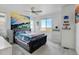 Bright bedroom with a comfortable bed, scenic wall art, and ample natural light at 9667 Walden St, Commerce City, CO 80022