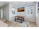 Cozy dining area illuminated by natural light, complete with a stylish table and bench at 9667 Walden St, Commerce City, CO 80022