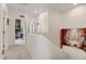 Bright hallway showcasing neutral walls, carpet flooring, and doorway access to bedrooms at 9667 Walden St, Commerce City, CO 80022