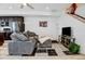 Inviting living room features a comfortable gray sofa, modern decor, and contemporary finishes at 9667 Walden St, Commerce City, CO 80022