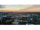 Stunning aerial view captures cityscape with mountains, showcasing the area's natural beauty at sunset at 1750 Wewatta St # 830, Denver, CO 80202