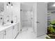 Bright bathroom features walk-in shower, white cabinets, and a large mirror at 1750 Wewatta St # 830, Denver, CO 80202