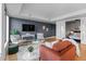 Elegant living room shows an open floor plan with a modern interior design and beautiful hardwood flooring at 1750 Wewatta St # 830, Denver, CO 80202