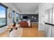 Open concept living space features hardwood floors, ample natural light, and views of the city at 1750 Wewatta St # 830, Denver, CO 80202