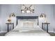Comfortable main bedroom with neutral walls, luxury linens, and accent lighting at 1750 Wewatta St # 830, Denver, CO 80202