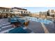 Rooftop pool and lounge area with sun loungers and city views at 1750 Wewatta St # 830, Denver, CO 80202