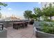 Building roof deck with city views, outdoor kitchen and dining area, and garden boxes at 1750 Wewatta St # 830, Denver, CO 80202