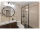 Contemporary bathroom with stylish vanity, herringbone tile accent wall, and glass-enclosed shower at 85 Uncle Sam Lode, Breckenridge, CO 80424