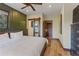 Cozy bedroom features wood-look floors, wood accents, and natural light from surrounding views at 85 Uncle Sam Lode, Breckenridge, CO 80424