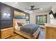 Comfortable bedroom featuring wood accents, a blue accent wall and beautiful outside views at 85 Uncle Sam Lode, Breckenridge, CO 80424