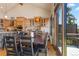 Cozy dining area with seating for eight and an adjacent kitchen area at 85 Uncle Sam Lode, Breckenridge, CO 80424