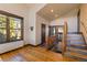 Welcoming entryway with wood floors, a window, and staircase at 85 Uncle Sam Lode, Breckenridge, CO 80424