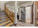 Finished basement hallway features wood accents, a sliding door to bathroom, and nearby stairway at 85 Uncle Sam Lode, Breckenridge, CO 80424