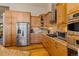 Stylish kitchen with stainless steel appliances, wooden cabinets, and a tile backsplash at 85 Uncle Sam Lode, Breckenridge, CO 80424