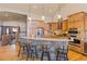 Well-appointed kitchen featuring wooden cabinetry, stone island with seating, and modern appliances at 85 Uncle Sam Lode, Breckenridge, CO 80424