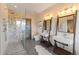 Spa-like bathroom with a glass-enclosed shower, dual vanities, and modern fixtures at 85 Uncle Sam Lode, Breckenridge, CO 80424