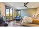 Cozy bedroom with a sliding door, mountain views and accent chair for relaxation at 85 Uncle Sam Lode, Breckenridge, CO 80424