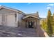 Home exterior with two-car garage, wooden deck, and view of the mountains and trees at 85 Uncle Sam Lode, Breckenridge, CO 80424