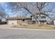 Charming single Gathering home with brick exterior, attached garage and mature trees in a suburban neighborhood at 10475 Tancred St, Northglenn, CO 80234