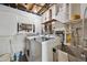 Laundry room with modern washer and dryer machines and utility sink at 10475 Tancred St, Northglenn, CO 80234