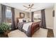 Cozy bedroom with hardwood floors, ceiling fan, neutral tones, and great natural light at 19429 W 88Th Dr, Arvada, CO 80007