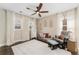 Bright bedroom with a ceiling fan, neutral walls, and multiple windows at 19429 W 88Th Dr, Arvada, CO 80007