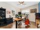 Bright office with hardwood floors, ceiling fan, and large windows at 19429 W 88Th Dr, Arvada, CO 80007