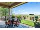 Covered patio area complete with mountain views, outdoor seating, and beautiful flowers at 19429 W 88Th Dr, Arvada, CO 80007