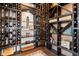 Custom wine cellar offers ample storage and display space for an extensive wine collection at 19429 W 88Th Dr, Arvada, CO 80007