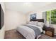 Stylish bedroom with a queen size bed, complemented by modern bedside tables and a soothing color scheme at 3082 S Wheeling Way # 202, Aurora, CO 80014