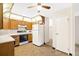 Efficient kitchen with appliances, wood cabinets, and open layout at 3082 S Wheeling Way # 202, Aurora, CO 80014