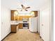 Efficient kitchen with appliances, wood cabinets, and open layout at 3082 S Wheeling Way # 202, Aurora, CO 80014