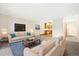 Comfortable living room featuring stylish furnishings and neutral colors and connected with a kitchen area at 3082 S Wheeling Way # 202, Aurora, CO 80014