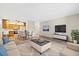 Inviting living room featuring a modern television and entertainment center, complemented by a neutral color palette at 3082 S Wheeling Way # 202, Aurora, CO 80014