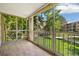 Enclosed outdoor patio with a view of the green lawn and surrounding buildings at 3082 S Wheeling Way # 202, Aurora, CO 80014