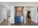 Wet bar featuring a built-in wine fridge and wood accents at 9382 Lark Sparrow Dr, Highlands Ranch, CO 80126