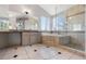 Spacious bathroom boasts a soaking tub, a walk-in shower, and a granite-topped vanity at 9382 Lark Sparrow Dr, Highlands Ranch, CO 80126