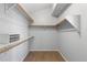 Walk-in closet with built-in shelving and storage space, ready for organization at 9382 Lark Sparrow Dr, Highlands Ranch, CO 80126