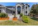 Up-close view of a charming home with manicured landscaping and a modern design at 9382 Lark Sparrow Dr, Highlands Ranch, CO 80126